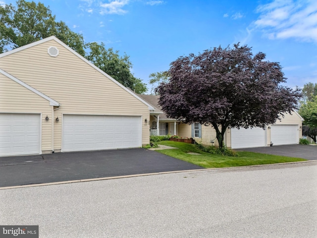 324 Winners Cir Unit 324, Red Lion, PA 17356 - view of front of home with a garage and driveway