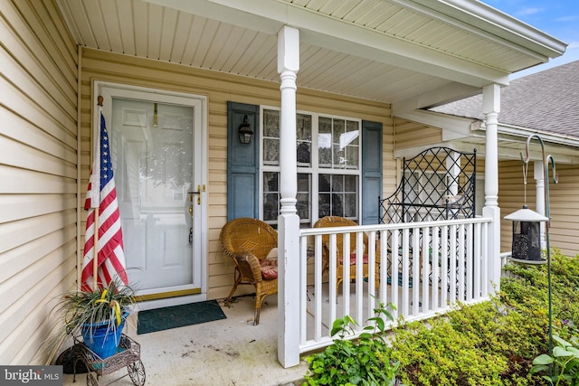 324 Winners Cir Unit 324, Red Lion, PA 17356 - view of exterior entry with covered porch and a shingled roof