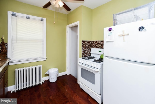 455 Lebaum St SE, Washington, DC 20032 - kitchen with white appliances, radiator, decorative backsplash, wood finished floors, and ceiling fan