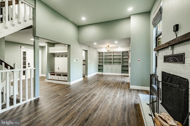 30 Scott Ct, Chesterbrook, PA 19087 - unfurnished living room featuring a stone fireplace, wood finished floors, stairs, and recessed lighting