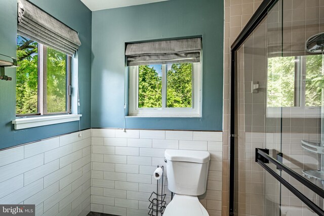 30 Scott Ct, Chesterbrook, PA 19087 - full bath with tile walls, healthy amount of natural light, a shower stall, and wainscoting