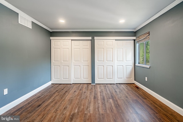 30 Scott Ct, Chesterbrook, PA 19087 - unfurnished bedroom featuring multiple closets, crown molding, dark wood finished floors, and recessed lighting