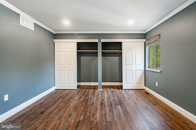 30 Scott Ct, Chesterbrook, PA 19087 - unfurnished bedroom with dark wood-type flooring, ornamental molding, and two closets