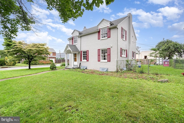 2941 N 6th St, Harrisburg, PA 17110 - view of front facade with a chimney, brick siding, and roof with shingles