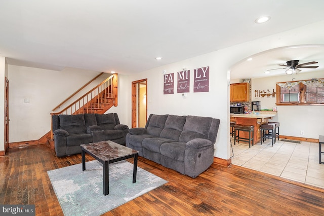 2941 N 6th St, Harrisburg, PA 17110 - living room featuring hardwood / wood-style floors, ceiling fan, stairway, recessed lighting, and arched walkways