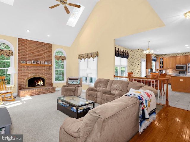 1509 Winfields Ln, Gambrills, MD 21054 - living area featuring a chandelier, ceiling fan, high vaulted ceiling, a fireplace, and recessed lighting