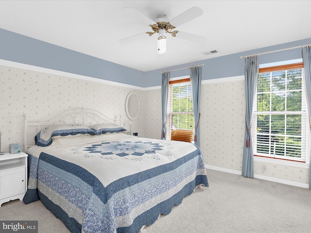 1509 Winfields Ln, Gambrills, MD 21054 - bedroom with wallpapered walls, light carpet, and ceiling fan