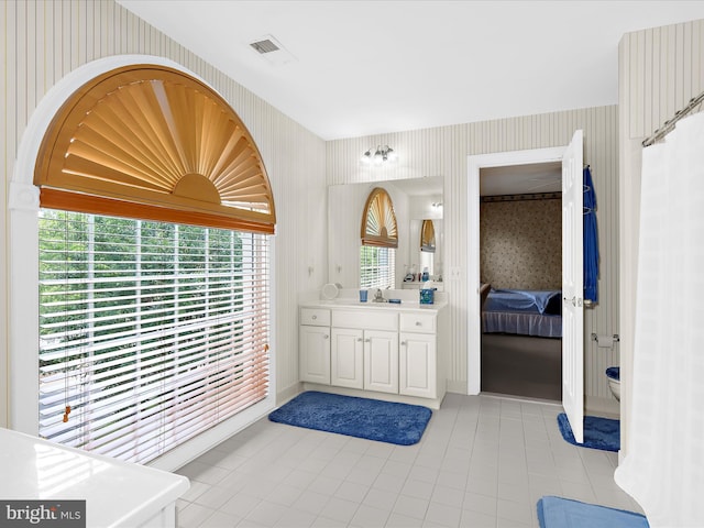 1509 Winfields Ln, Gambrills, MD 21054 - ensuite bathroom with wallpapered walls, vanity, and tile patterned floors