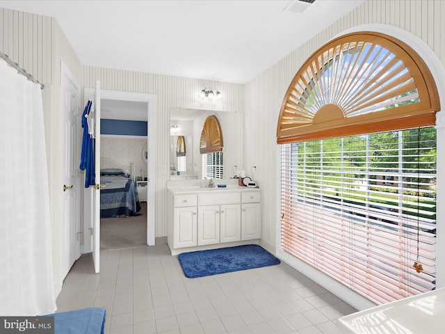 1509 Winfields Ln, Gambrills, MD 21054 - ensuite bathroom with wallpapered walls, vanity, and tile patterned floors