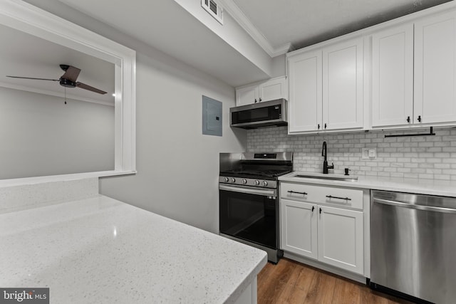8677 Greenbelt Rd Unit 201, Greenbelt, MD 20770 - kitchen featuring appliances with stainless steel finishes, ornamental molding, electric panel, ceiling fan, and white cabinetry