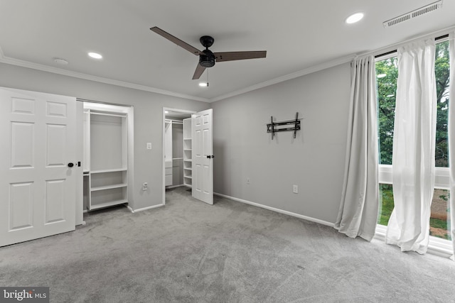8677 Greenbelt Rd Unit 201, Greenbelt, MD 20770 - unfurnished bedroom featuring carpet, recessed lighting, ornamental molding, a ceiling fan, and two closets