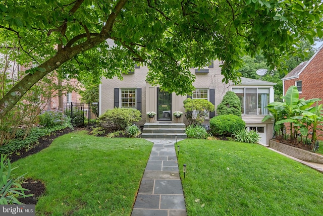 411 Windsor St, Silver Spring, MD 20910 - view of front facade with brick siding and a sunroom