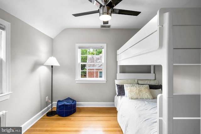 411 Windsor St, Silver Spring, MD 20910 - unfurnished bedroom with wood finished floors, lofted ceiling, a ceiling fan, and radiator heating unit