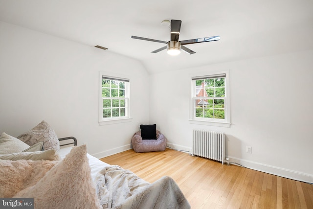 411 Windsor St, Silver Spring, MD 20910 - living area with radiator, healthy amount of natural light, wood finished floors, ceiling fan, and lofted ceiling