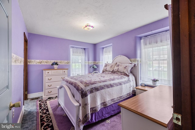 1445 Farmington Ave, Pottstown, PA 19464 - bedroom featuring dark colored carpet and a textured ceiling
