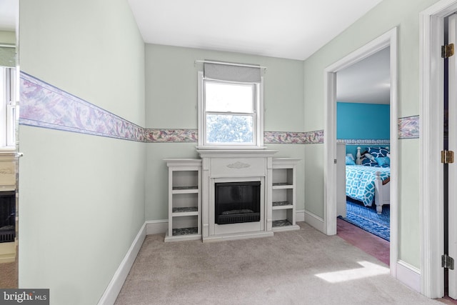 1445 Farmington Ave, Pottstown, PA 19464 - unfurnished living room featuring carpet floors and a glass covered fireplace