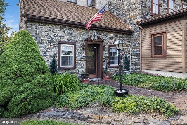 1445 Farmington Ave, Pottstown, PA 19464 - property entrance with a shingled roof and stone siding