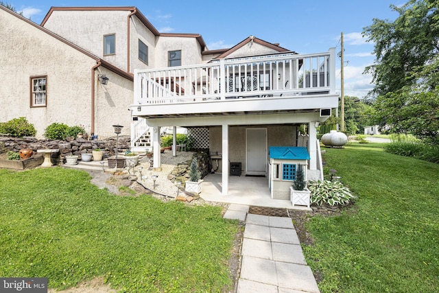 1445 Farmington Ave, Pottstown, PA 19464 - back of property featuring stucco siding, a yard, a deck, a patio, and stairs