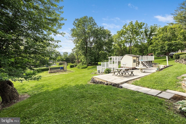 1445 Farmington Ave, Pottstown, PA 19464 - view of green lawn with an outbuilding, a patio area, and view of scattered trees