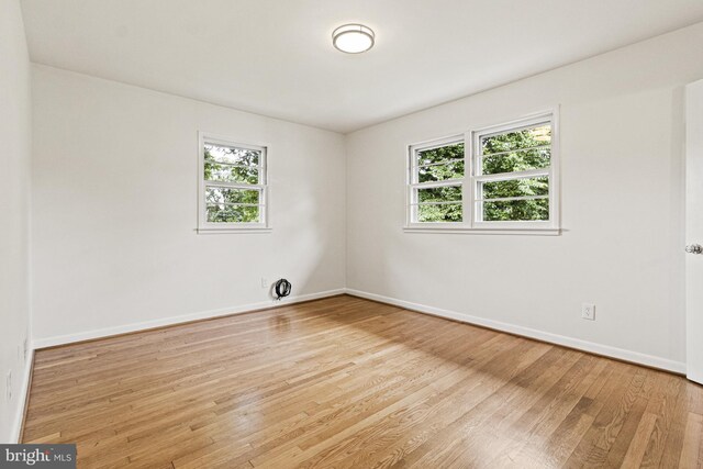 7119 Sea Cliff Rd, Mclean, VA 22101 - spare room with plenty of natural light and wood finished floors