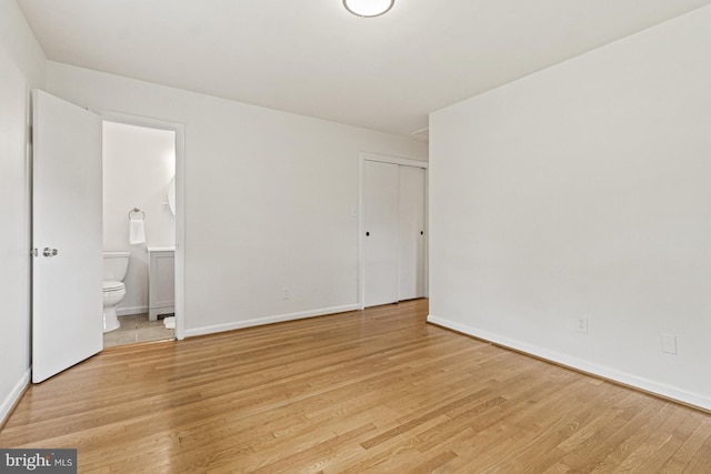 7119 Sea Cliff Rd, Mclean, VA 22101 - unfurnished bedroom with light wood-type flooring, ensuite bath, and a closet