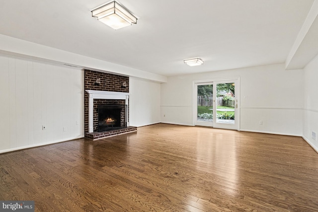7119 Sea Cliff Rd, Mclean, VA 22101 - unfurnished living room with wood finished floors and a fireplace
