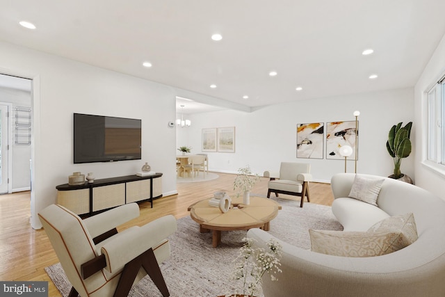 7119 Sea Cliff Rd, Mclean, VA 22101 - living area with light wood-type flooring, recessed lighting, and a chandelier