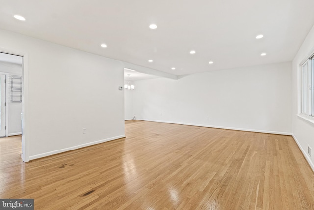 7119 Sea Cliff Rd, Mclean, VA 22101 - spare room with light wood-style flooring, recessed lighting, and a chandelier