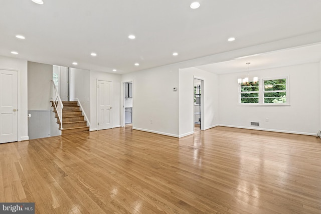 7119 Sea Cliff Rd, Mclean, VA 22101 - unfurnished living room with stairs, light wood-style flooring, a chandelier, and recessed lighting