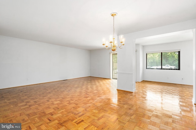 7 Stonehenge Unit 7-5, Pikesville, MD 21208 - unfurnished room with a chandelier and baseboards