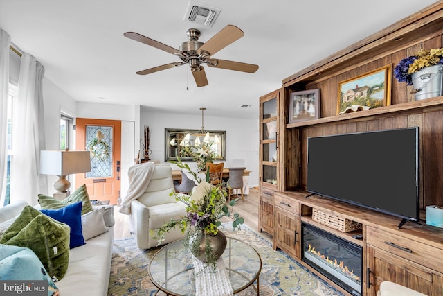 19 Warwick Way, Southampton, NJ 08088 - living area featuring ceiling fan, light wood-style flooring, and a chandelier