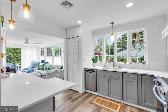 19 Warwick Way, Southampton, NJ 08088 - kitchen with stainless steel appliances, gray cabinets, open floor plan, light countertops, and recessed lighting