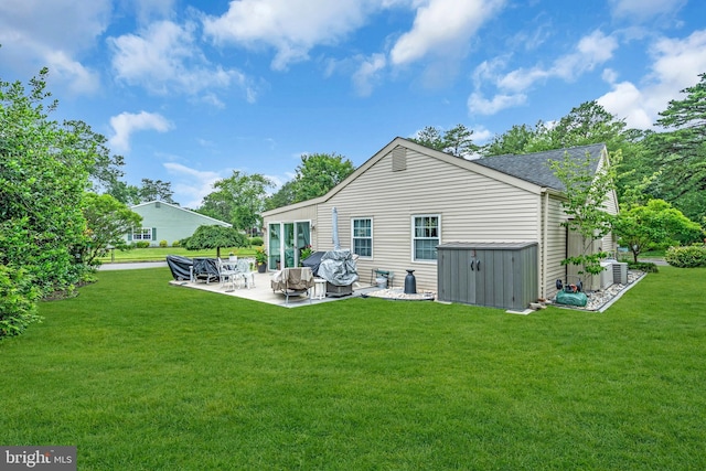 19 Warwick Way, Southampton, NJ 08088 - back of property featuring a patio, a lawn, and a shingled roof