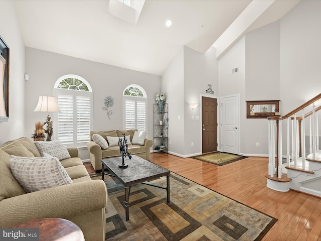 5910 Constance Way, New Market, MD 21774 - living room with high vaulted ceiling, wood finished floors, and stairway