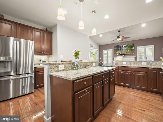 5910 Constance Way, New Market, MD 21774 - kitchen featuring stainless steel fridge, light wood-style flooring, ceiling fan, a center island, and lofted ceiling