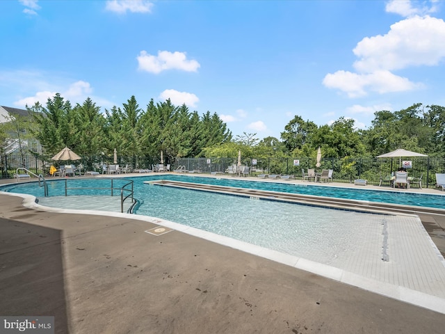 5910 Constance Way, New Market, MD 21774 - community pool featuring a patio area and view of scattered trees