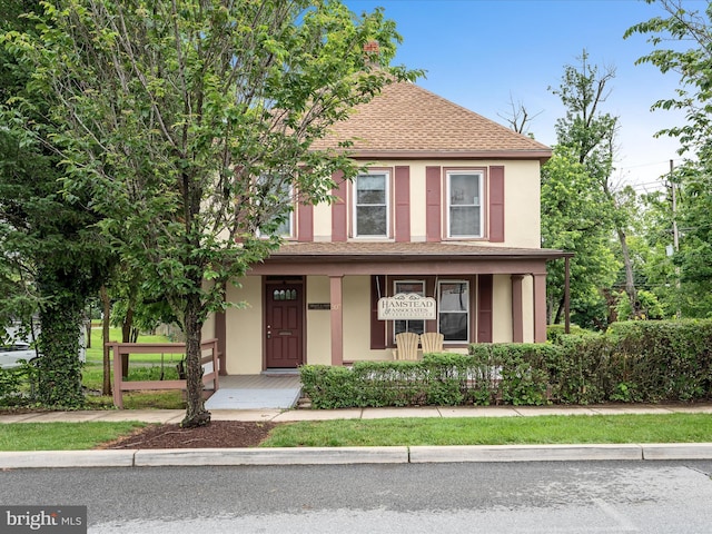 507 S Fairfax Blvd, Charles Town, WV 25414 - view of front of property with a porch, a shingled roof, and stucco siding
