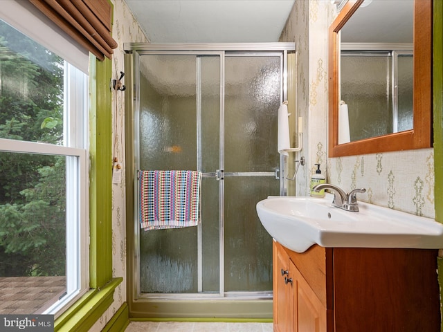 507 S Fairfax Blvd, Charles Town, WV 25414 - bathroom featuring vanity, a stall shower, and wallpapered walls