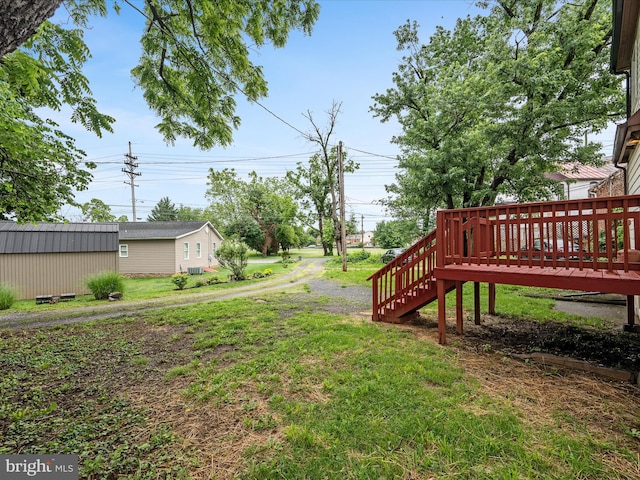 507 S Fairfax Blvd, Charles Town, WV 25414 - view of grassy yard featuring a deck and stairs