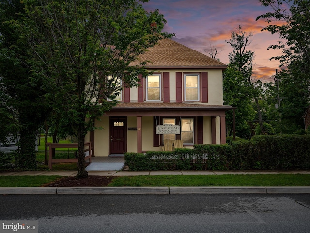 507 S Fairfax Blvd, Charles Town, WV 25414 - view of front of house featuring a porch, a shingled roof, and stucco siding