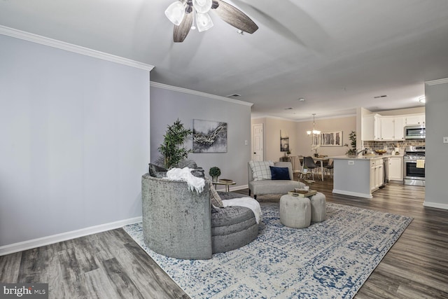 20408 Shore Harbour Dr Unit 5-C, Germantown, MD 20874 - living room with ceiling fan, dark wood-style floors, ornamental molding, and a chandelier