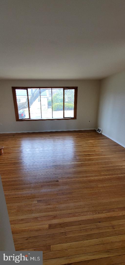 200 Baldwin Ave, Ridley Park, PA 19078 - empty room with wood finished floors and baseboards