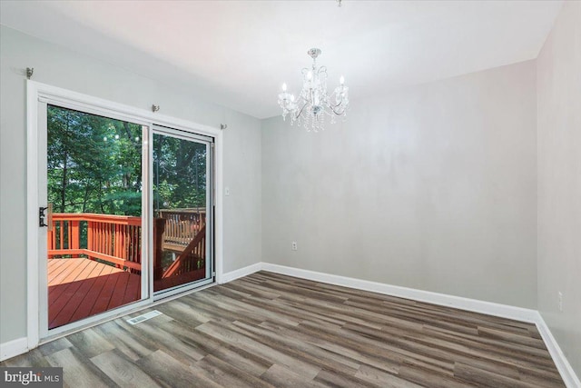 6116 Baldridge Ter, Frederick, MD 21701 - spare room with wood finished floors and a chandelier