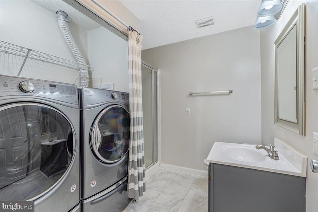 6116 Baldridge Ter, Frederick, MD 21701 - washroom with light marble finish flooring and washer and clothes dryer