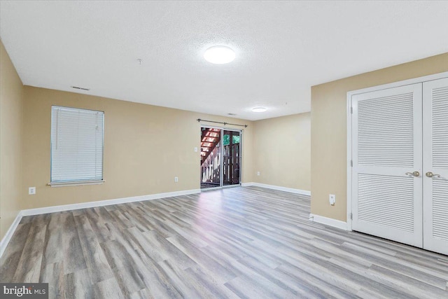 6116 Baldridge Ter, Frederick, MD 21701 - unfurnished room with wood finished floors and a textured ceiling