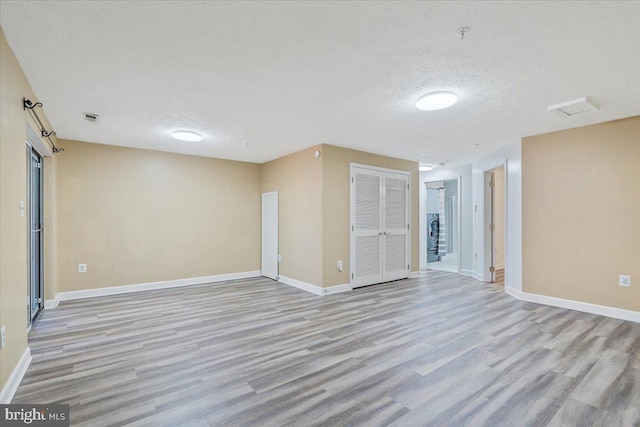 6116 Baldridge Ter, Frederick, MD 21701 - empty room featuring wood finished floors and a textured ceiling