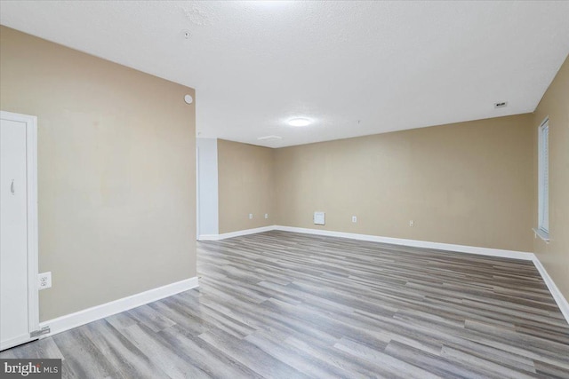 6116 Baldridge Ter, Frederick, MD 21701 - spare room with wood finished floors and a textured ceiling