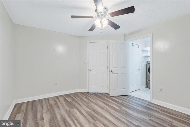 6116 Baldridge Ter, Frederick, MD 21701 - unfurnished bedroom with light wood finished floors, a closet, washer / clothes dryer, and ceiling fan