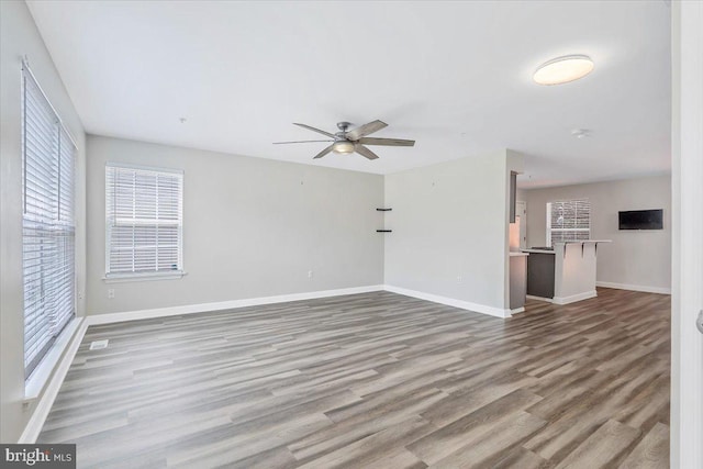 6116 Baldridge Ter, Frederick, MD 21701 - unfurnished living room with wood finished floors and a ceiling fan