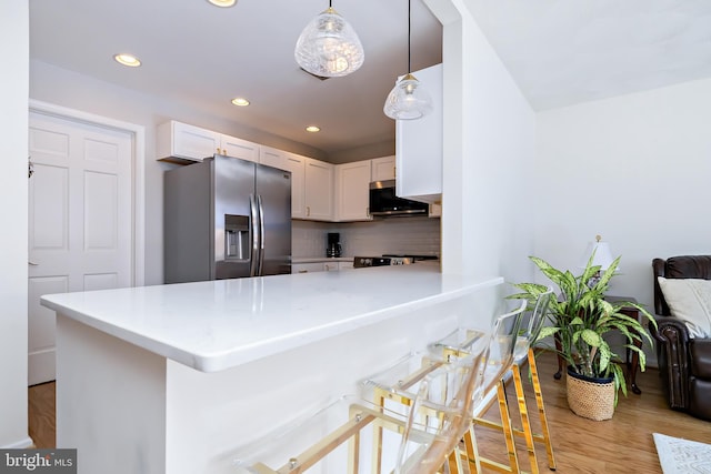 14 Haddonfield Cmns Unit 14, Haddonfield, NJ 08033 - kitchen featuring stainless steel appliances, light wood finished floors, white cabinetry, backsplash, and recessed lighting